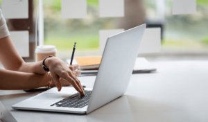 lady working on laptop support small businesses