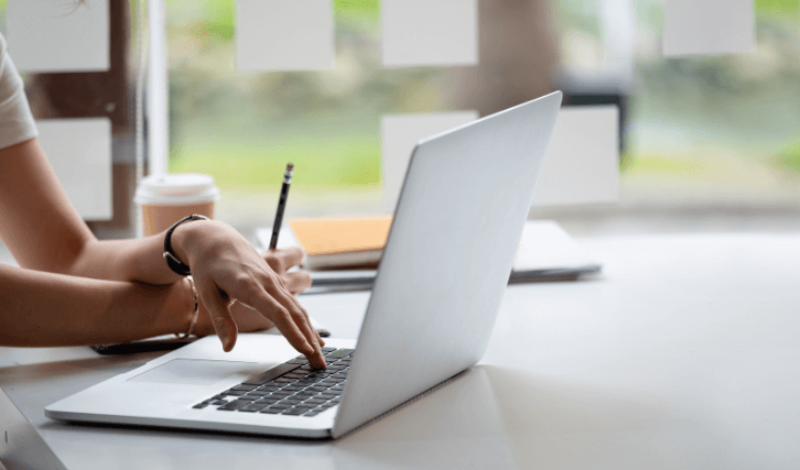 lady working on laptop support small businesses