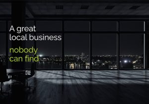 Dark modern office space overlooking a city at night with text reading 'a great local business, noone can find'
